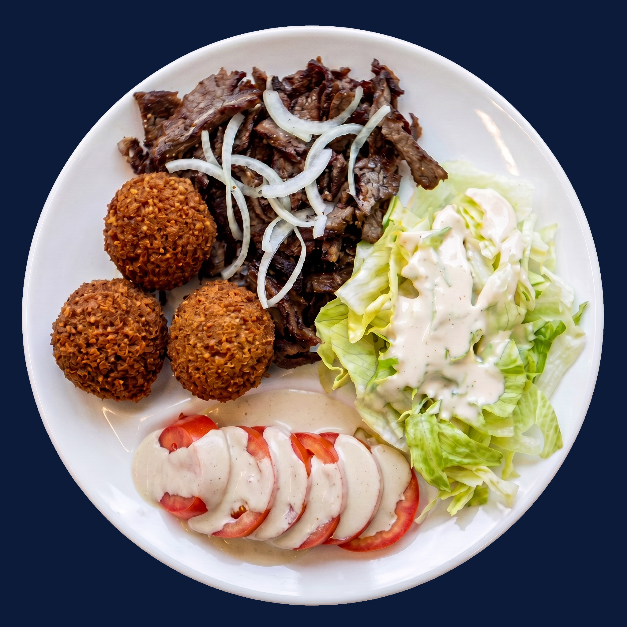 Arax combo plate with falafel, shawarma and fresh vegetables