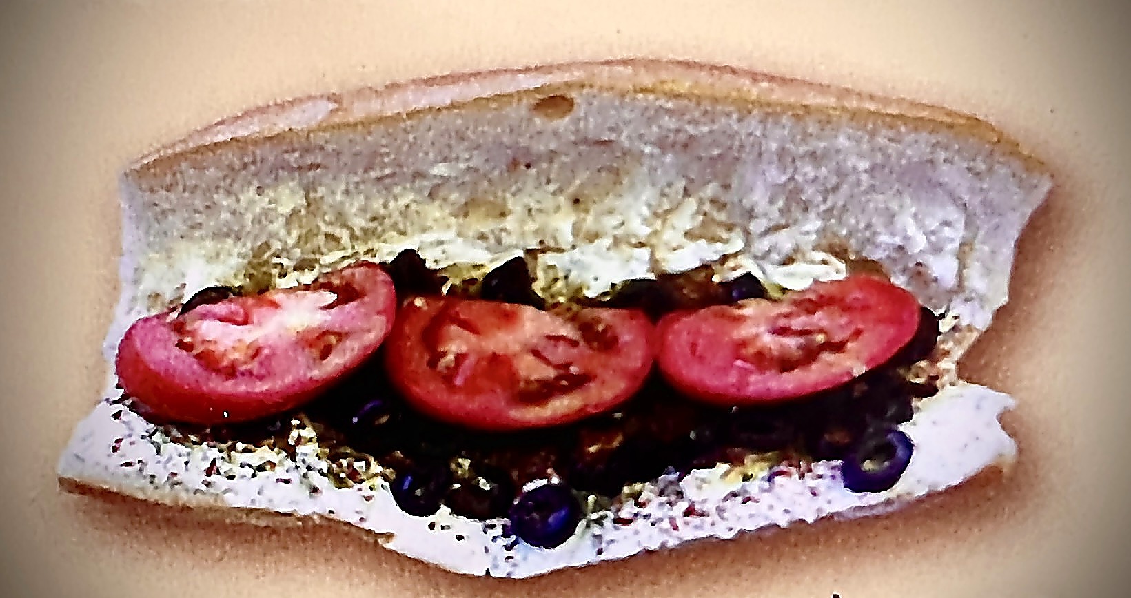 Lebni sandwich with tomato and black olives on french roll