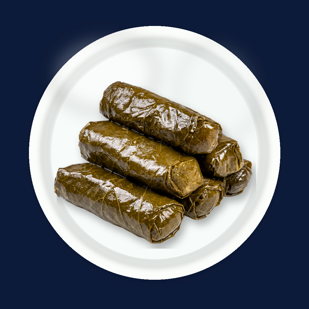 Stuffed grape leaves on a white plate