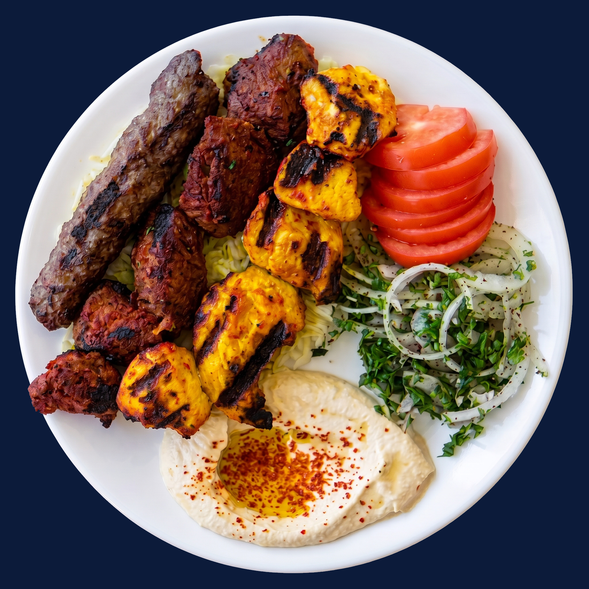 Kebab combo plate with chicken, beef shish and lule kebab skewers over rice
